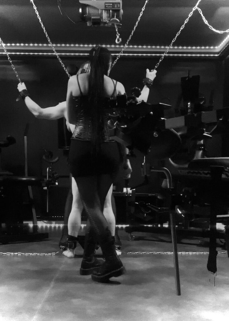 Picture of Mistrix Syx first session in a professional dungeon, their journey towards becoming a professional dominatrix.